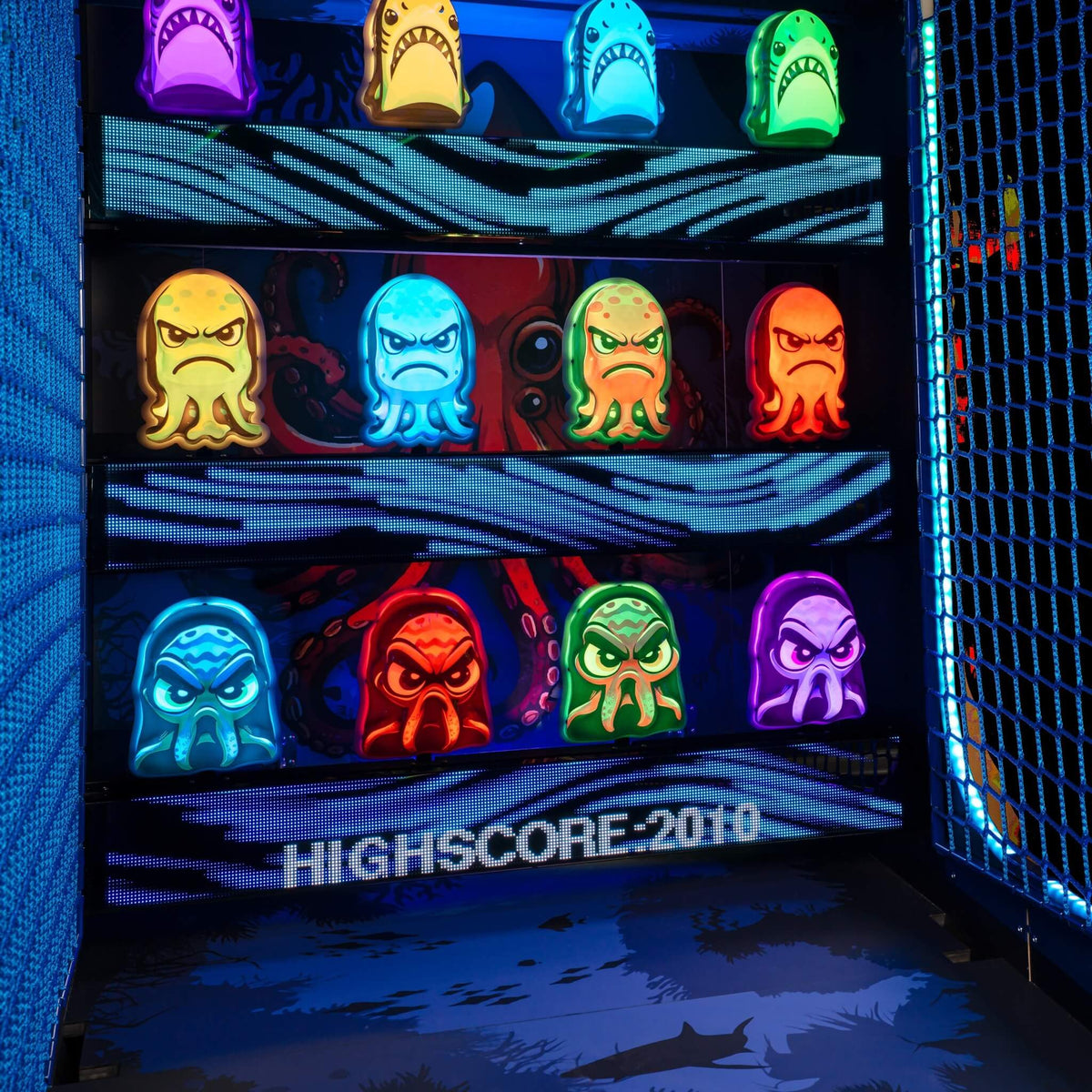 Lit squid and shark targets inside the WIK Squid Battle arcade machine