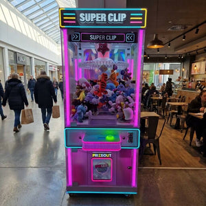 WIK Super Clip prize machine in a shopping centre walkway next to a cafe