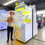 Smiling teenager holding a teddy bear won from the WIK Toy Star Small in a family entertainment centre