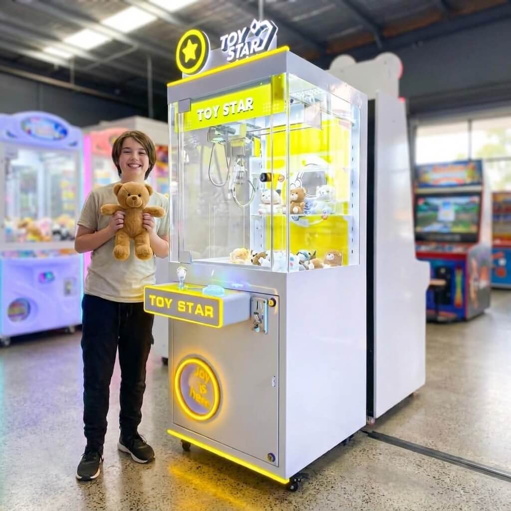 Smiling teenager holding a teddy bear won from the WIK Toy Star Small in a family entertainment centre