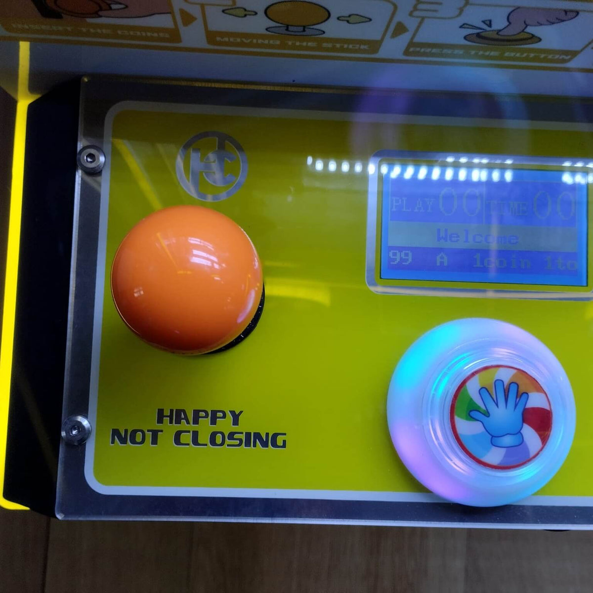 Close-up of a WIK Trend Star control panel with orange joystick, lit button and display