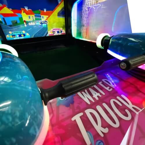 Water guns at the player stations of the WIK Water Truck Kids arcade machine