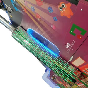 Lit side rail and WIK logo on the WIK Water Truck arcade machine