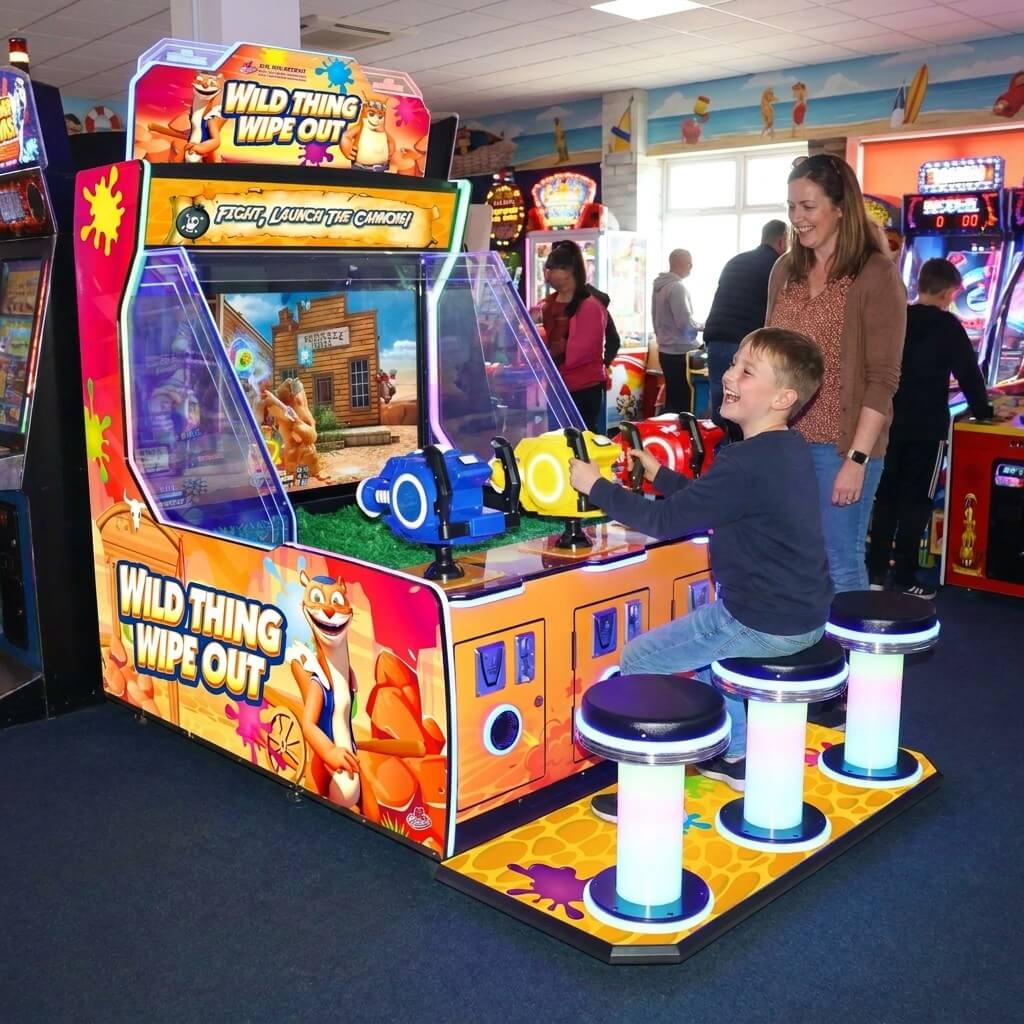 Wild-Thing Wipe-Out DX arcade machine in a UK seaside arcade with a child playing
