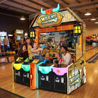 Four friends playing Wild West Shootout 2 at a bowling alley in the evening